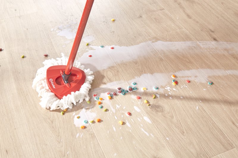 Mopping spilled milk on a Pergo Elements waterproof floor